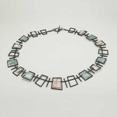 Necklace, Black framed necklace in silver with morganite and aquamarines